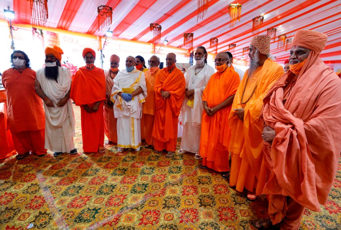 Hindu priests gather for a groundbreaking ceremony of a temple dedicated to the Hindu god Ram in Ayodhya, India, Wednesday, Aug. 5, 2020.