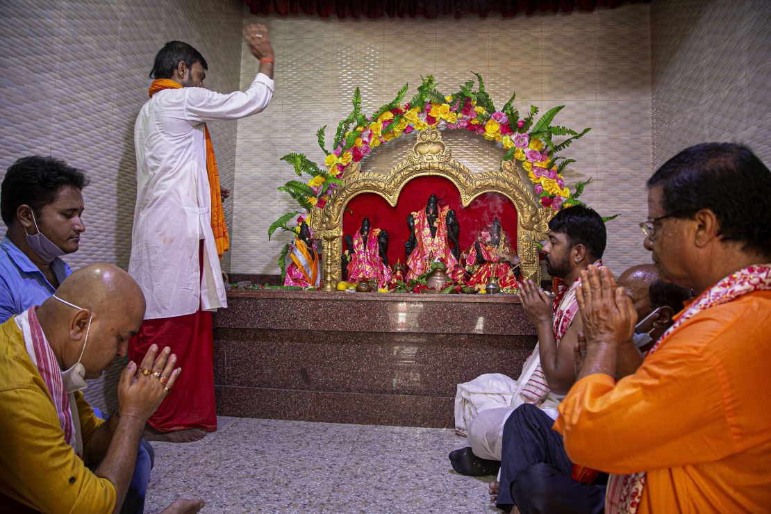 Hindus perform special prayers to mark the groundbreaking ceremony of a temple dedicated to the Hindu god Ram in Ayodhya, in Gauhati, India, August 5, 2020. 