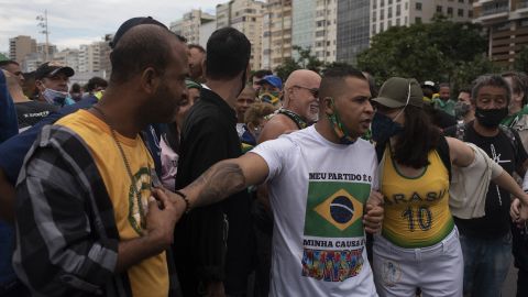 Supporters of Brazilian President Jair Messias Bolsonaro gather to support him and protest against racism and the death of black people in Brazil's slums during a Black Lives Matter protest at Copacabana beach in Rio de Janeiro on June 7, 2020.