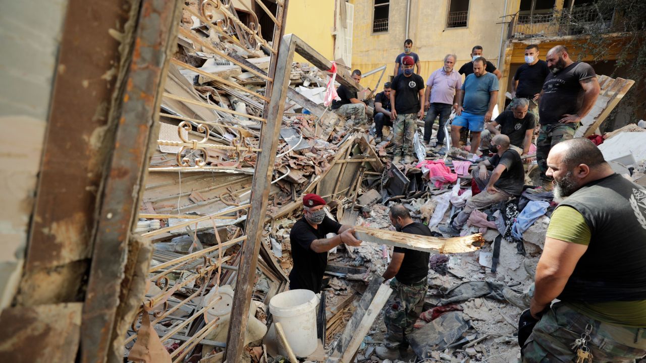 Lebanese soldiers search for survivors after a massive explosion in Beirut, Lebanon, Wednesday, Aug. 5, 2020. The explosion flattened much of a port and damaged buildings across Beirut, sending a giant mushroom cloud into the sky. In addition to those who died, more than 3,000 other people were injured, with bodies buried in the rubble, officials said.(AP Photo/Hassan Ammar)