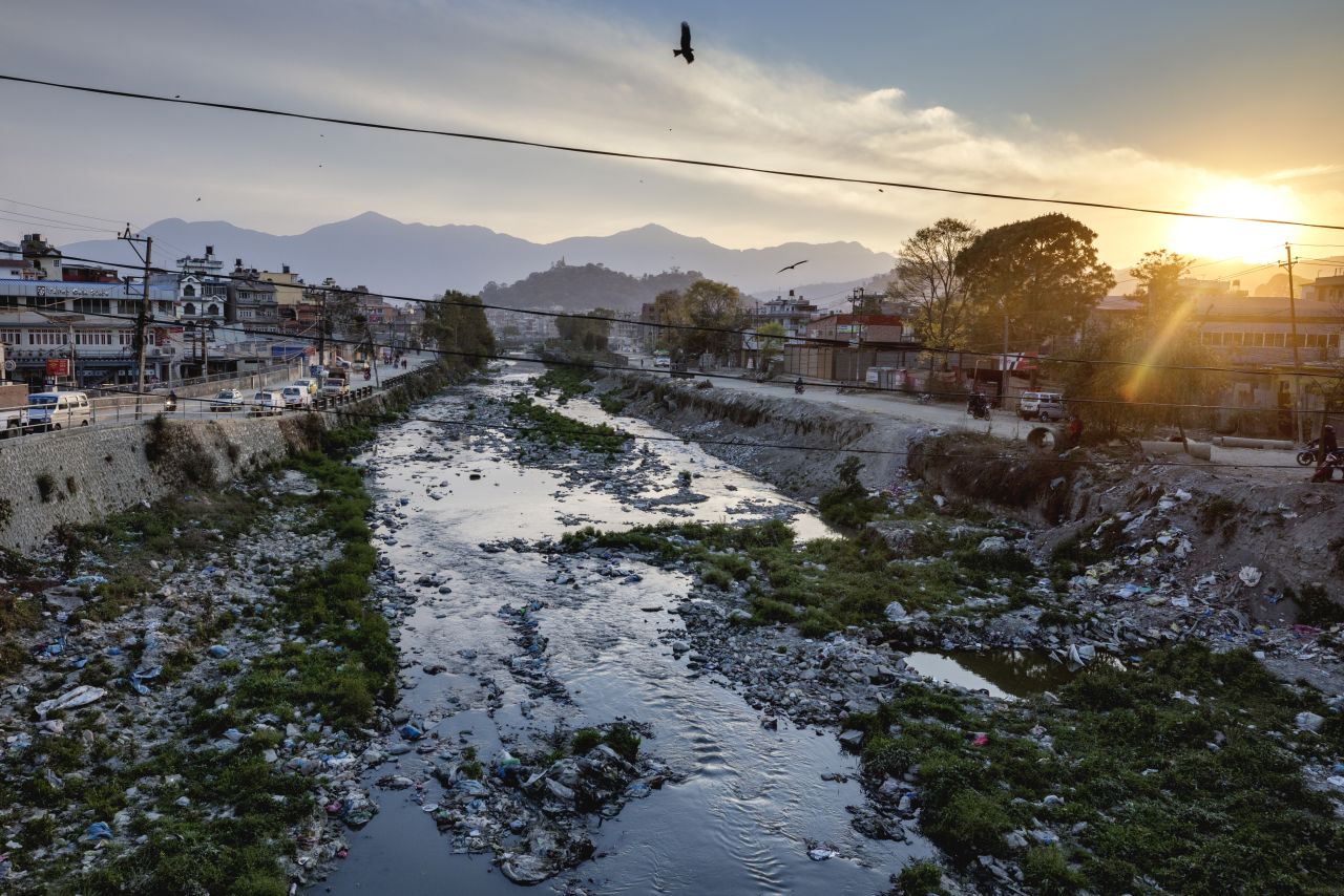 Garbage floats on the Bisnumati River in Kathmandu, Nepal, alongside a flood of less visible pollutants, many from the valley's textile factories. 
