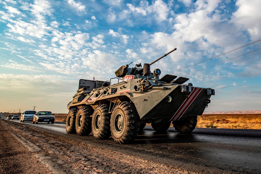 A Russian military police armored personnel carrier (APC) drives along a road in the countryside near the northeastern Syrian town of Amuda in Hasakeh province on October 24, 2019, as part of a joint patrol between Russian forces and Syrian Kurdish Asayish internal security forces near the border with Turkey. 