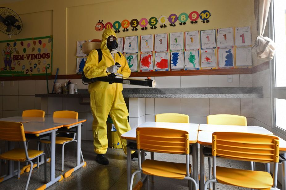 A worker disinfects a public school in Brasilia, Brazil, on August 5. The local government has begun preparations for the reopening of schools in early September.