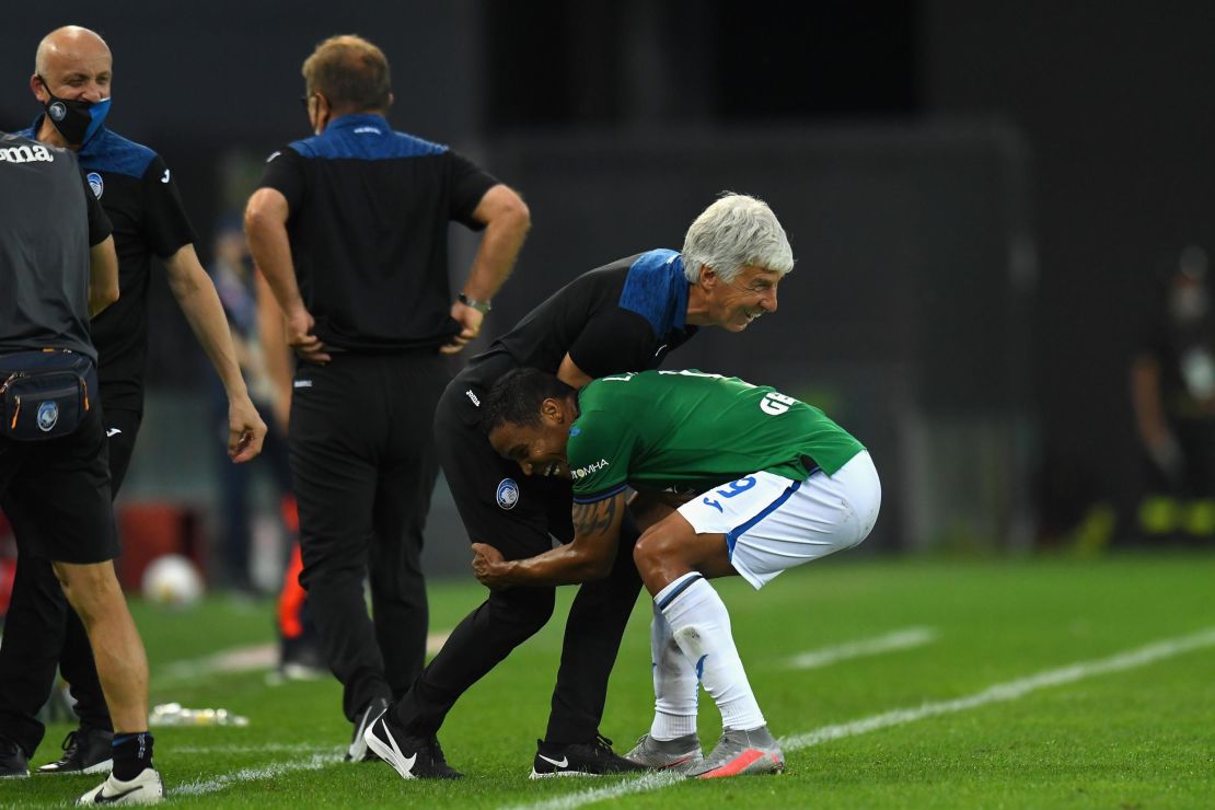 Muriel celebrates with Gasperini after scoring against Udinese.