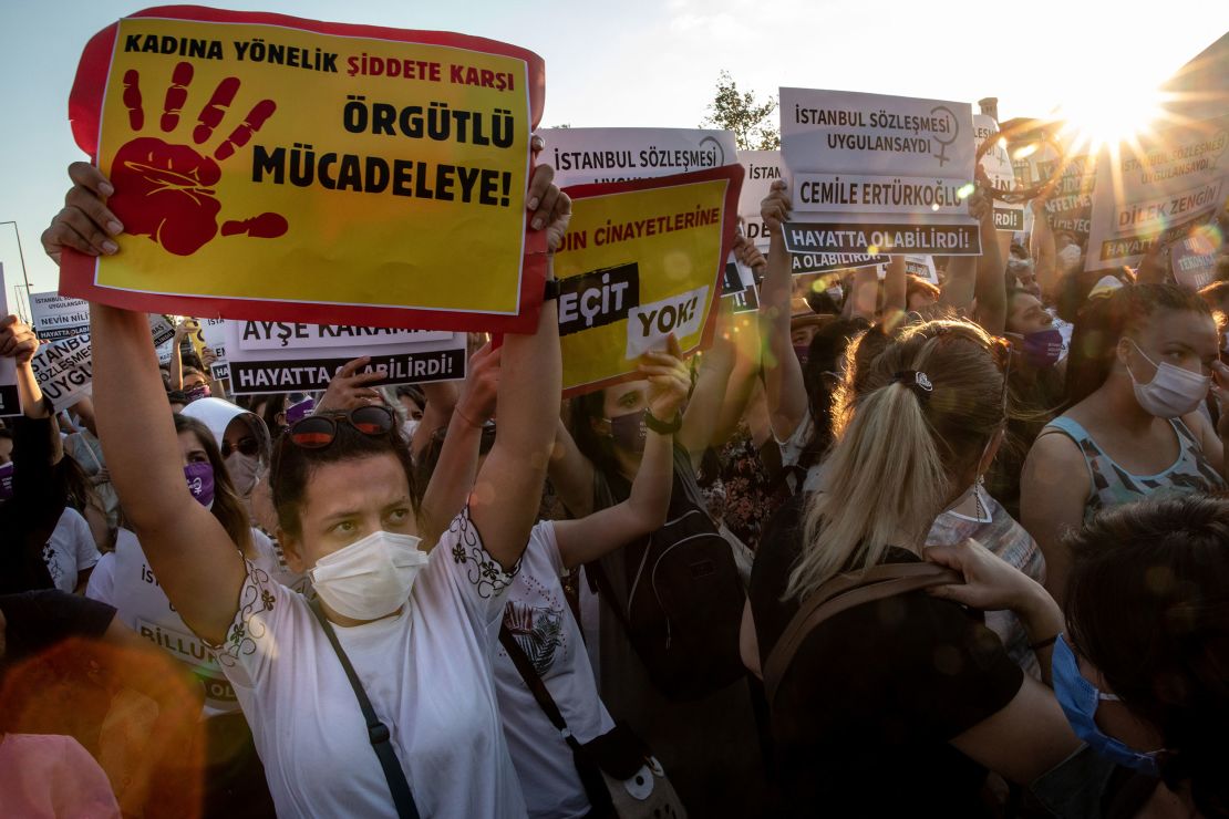 Women chant slogans and wave signs during the demonstration in Istanbul on Wednesday.