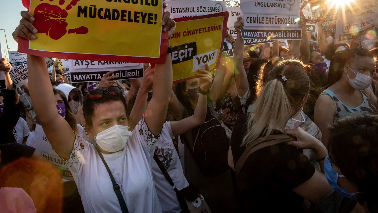 Women chant slogans and wave signs during the demonstration in Istanbul on Wednesday.
