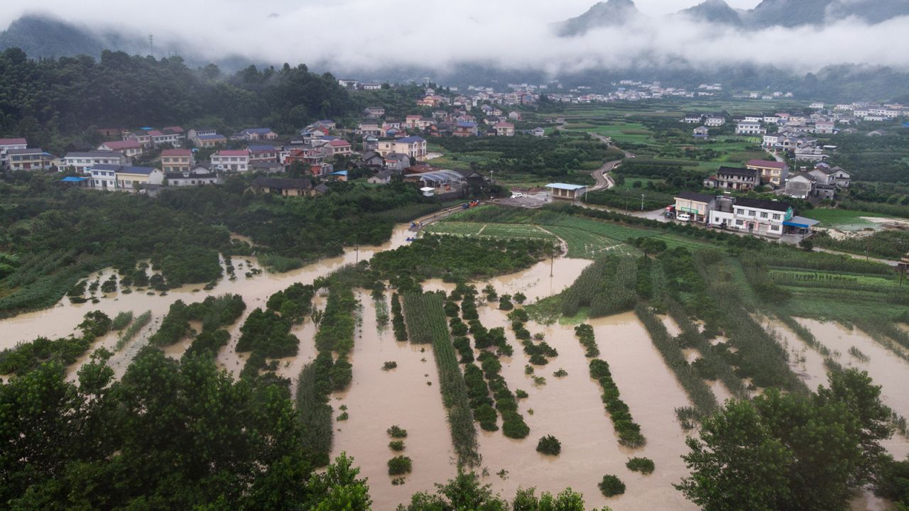This aerial photo taken on July 6 shows flooded farmland in Shimen County, in central China's Hunan Province. The country has been hit by the worst flooding it has experienced in years.