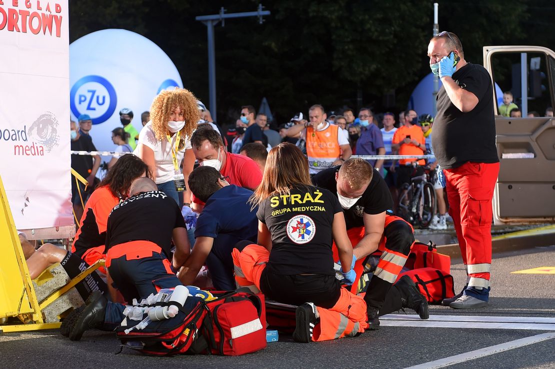 Medics attend to Jakobsen after the crash.