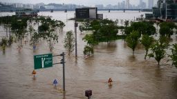 TOPSHOT - A general view shows flooding over a submerged park beside the Han river Seoul on August 3, 2020. - Heavy rain hit South Korea's central regions causing flooded houses and roads, Yonhap news agency reported, prompting authorities to seal off riverside and mountainous areas. (Photo by Ed JONES / AFP) (Photo by ED JONES/AFP via Getty Images)