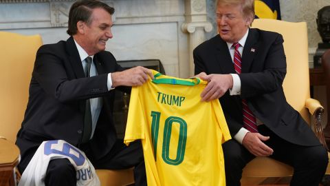 Brazilian President Jair Bolsonaro presents U.S. President Donald Trump with a Brazil national team jersey at the White House on March 19, 2019 in Washington, DC.