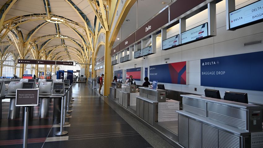 A view of empty Delta check-in counters at Washington National Airport (DCA) on April 11, 2020 in Arlington, Virginia. - Many flights are canceled due to the spread of the Coronavirus over the US. (Photo by Daniel Slim/AFP/Getty Images)
