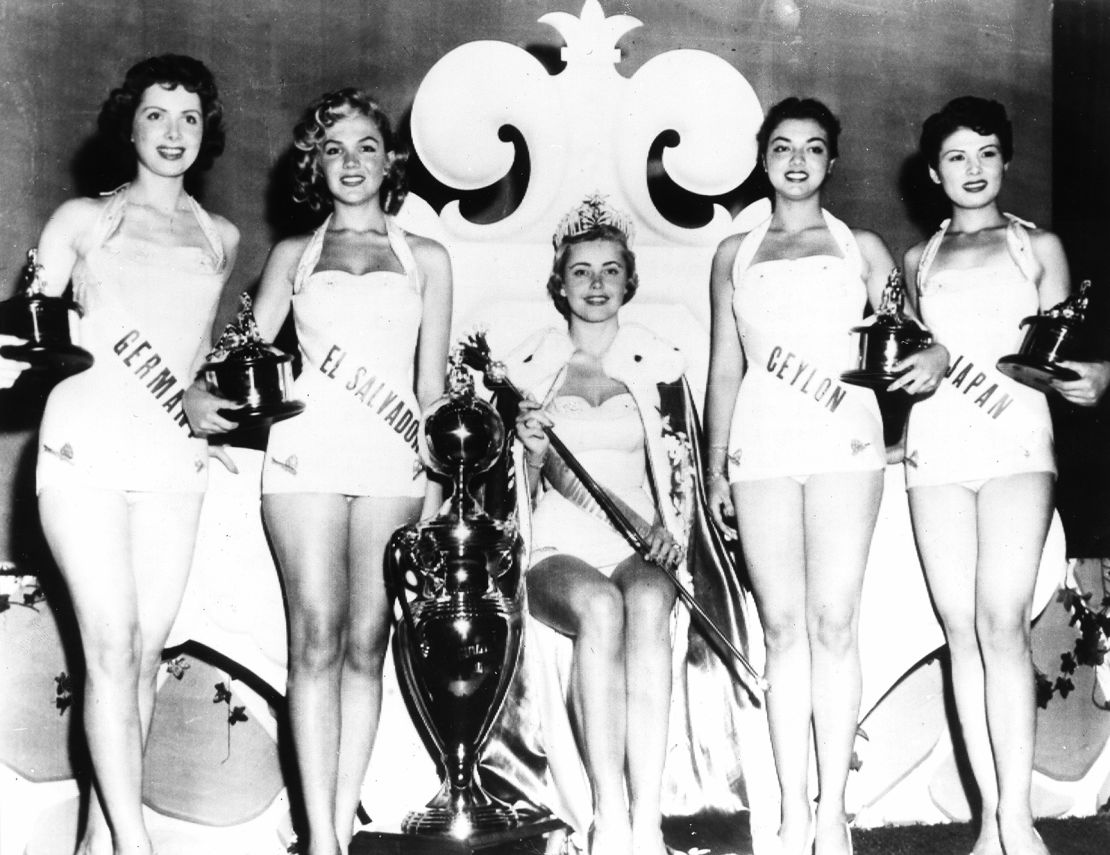 Early in their histories, beauty pageants -- some dating back to the 1920s -- barred women of color from participating. Here, a group of contestants pose during the 1955 Miss Universe pageant. It would be another 22 years before a Black woman won the crown.