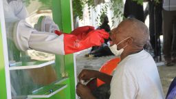 A patient takes a coronavirus test at the University of Maiduguri Teaching Hospital isolation centre on May 10, 2020. - Nigeria, Africa's most populous nation, has confirmed 3,912 infections and 117 deaths from the novel coronavirus.