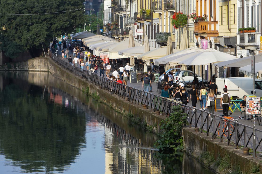 Milan in May. People in Italy are going out for dinner at restaurants, and enjoying the summer tradition of an aperitivo at a local square or bar.