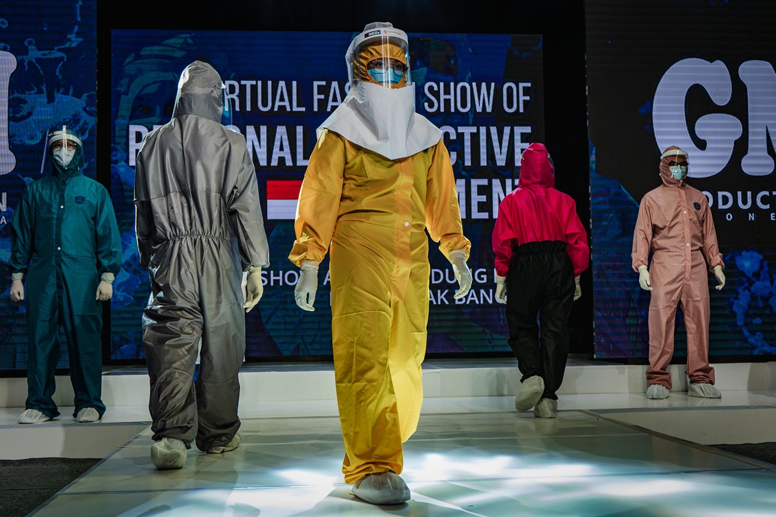 Medical workers in Yogyakarta, Indonesia, showcase designs during a fashion show of personal protective equipment on August 1. The fashion show was held as a form of gratitude for all medical personnel who have been fighting Covid-19.