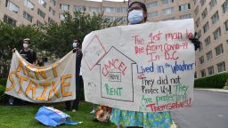 Renters of the Woodner apartment building in Washington, DC, protest to demand their rent be forgiven during the COVID-19 pandemic on May 28, 2020. (Photo by Nicholas Kamm/AFP/Getty Images)