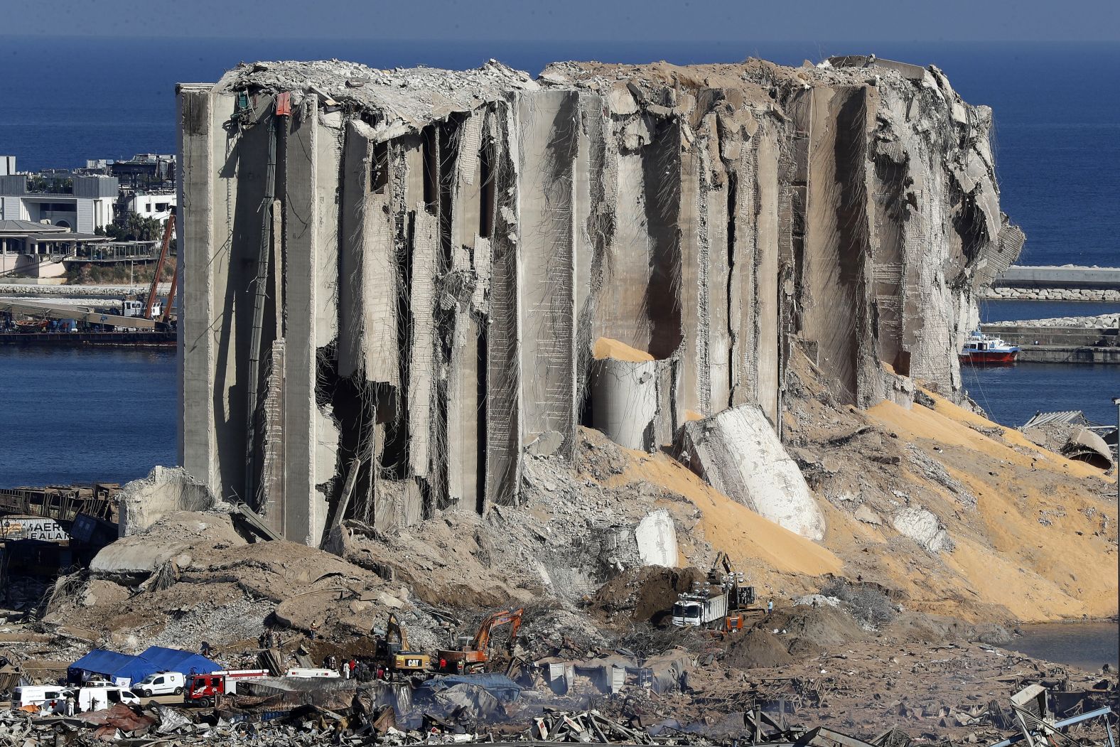 Rescue workers search for missing people at the site of the explosion.