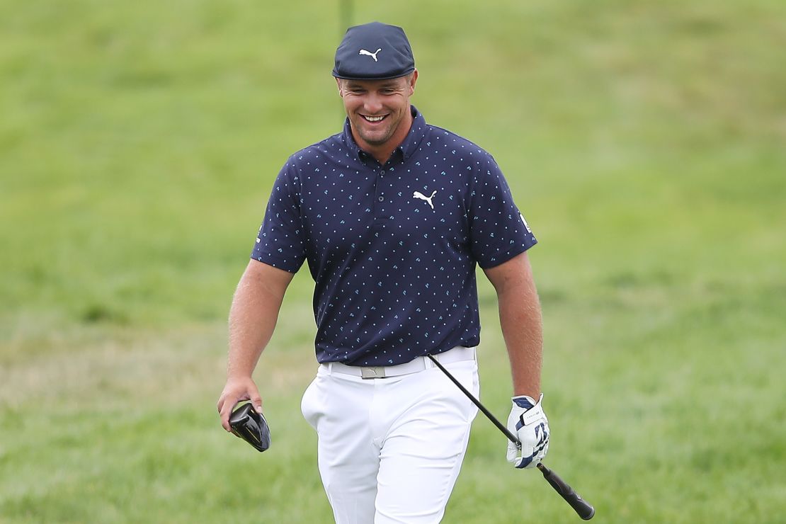 DeChambeau smiles after breaking his driver on the seventh tee during the first round of the 2020 PGA Championship.