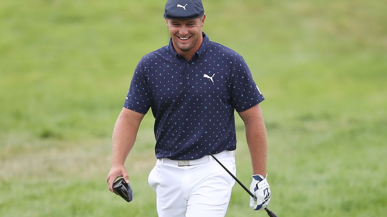 DeChambeau smiles after breaking his driver on the seventh tee during the first round of the 2020 PGA Championship.
