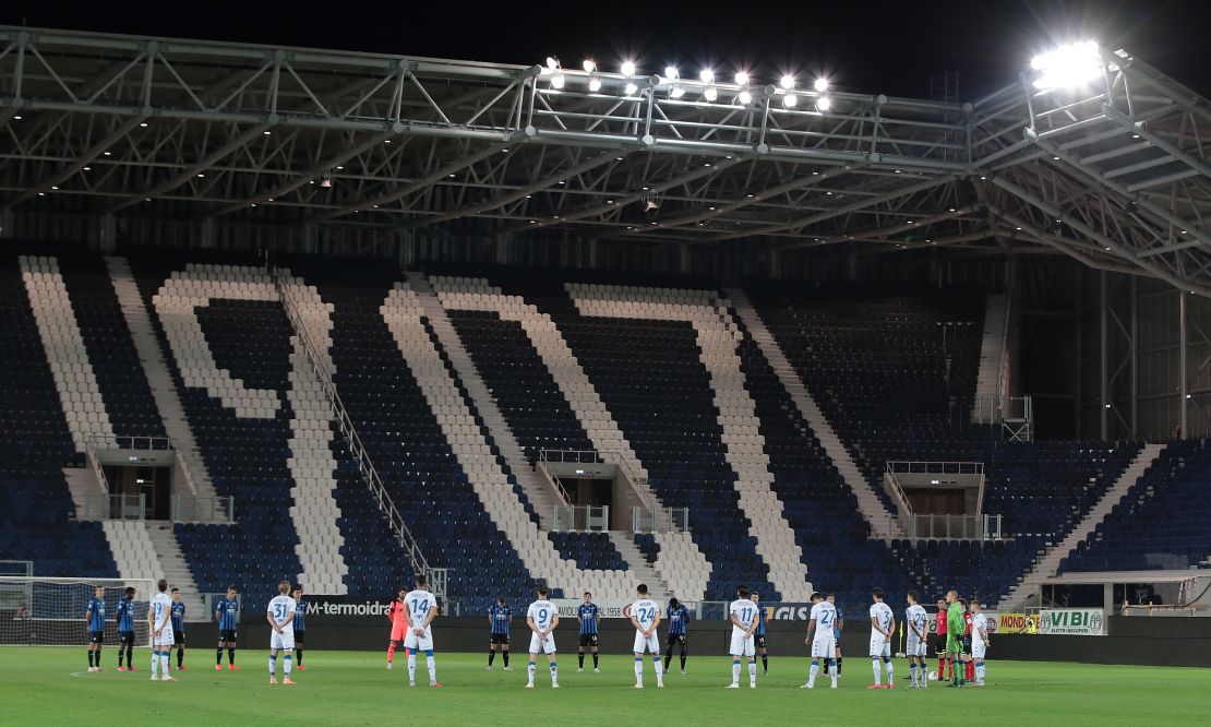 Players from Atalanta and Brescia -- another team based in Lombardy -- pay their respects in memory of Covid-19 victims prior to the Serie A match between the two teams in July.