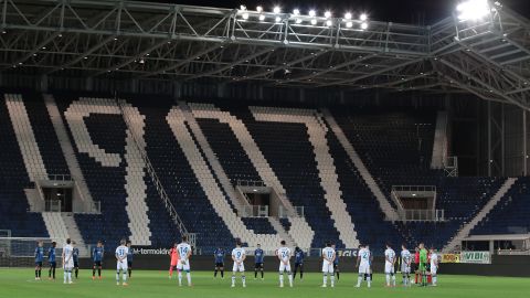 Players from Atalanta and Brescia -- another team based in Lombardy -- pay their respects in memory of Covid-19 victims prior to the Serie A match between the two teams in July.
