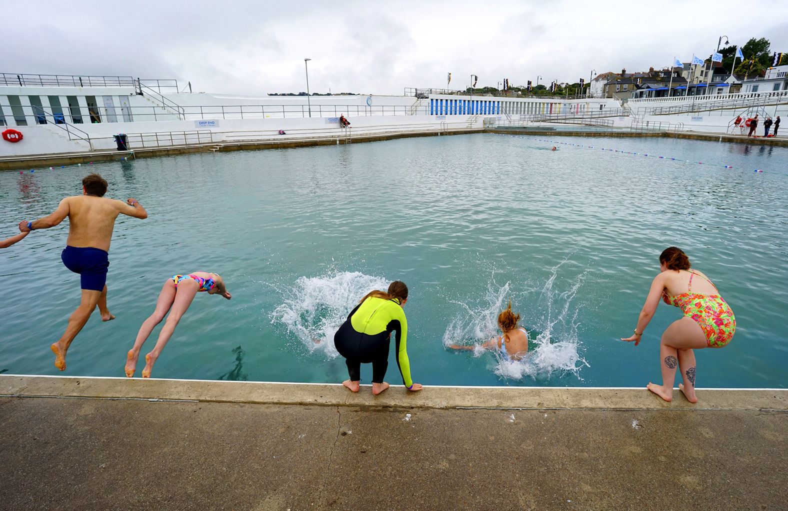 People swim at Jubilee Pool, an open-air seawater pool, after it reopened in Penzance, England, on July 25.