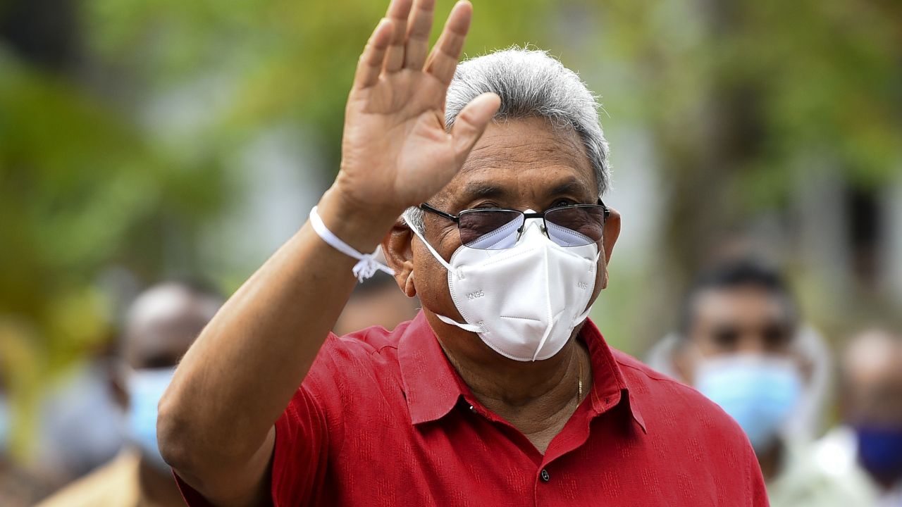 Sri Lanka's President Gotabaya Rajapaksa waves as he leaves a polling station after casting his ballot in Colombo on August 5, 2020.