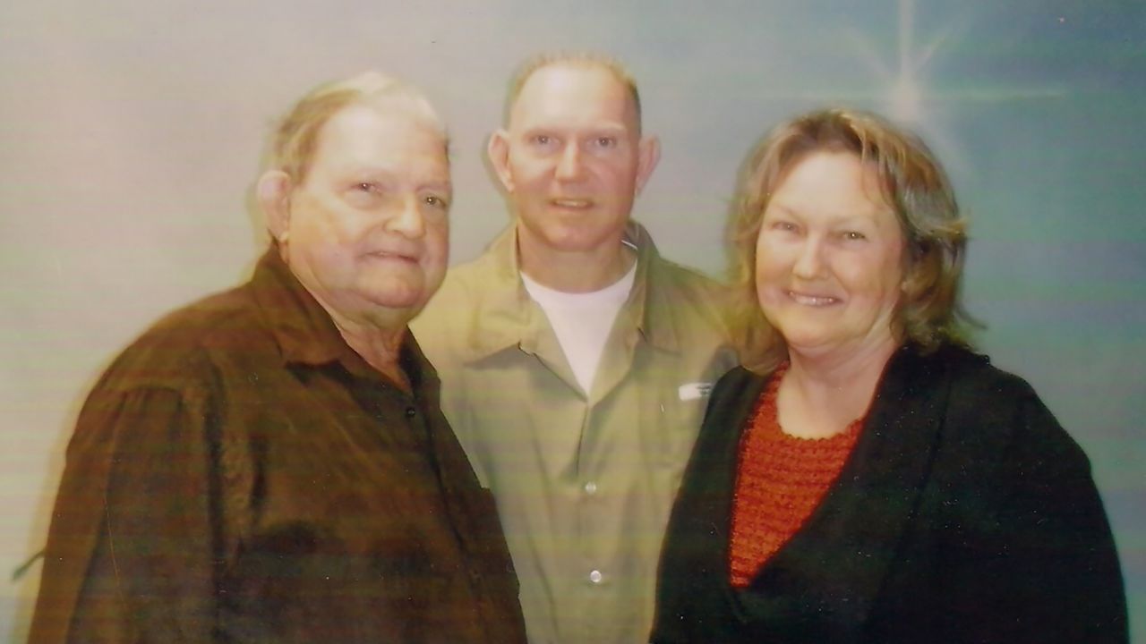 Bobby Williams, center, an inmate at FCI Seagoville who has tested positive for coronavirus, with his parents, Bobby and May Belle, in 2012.