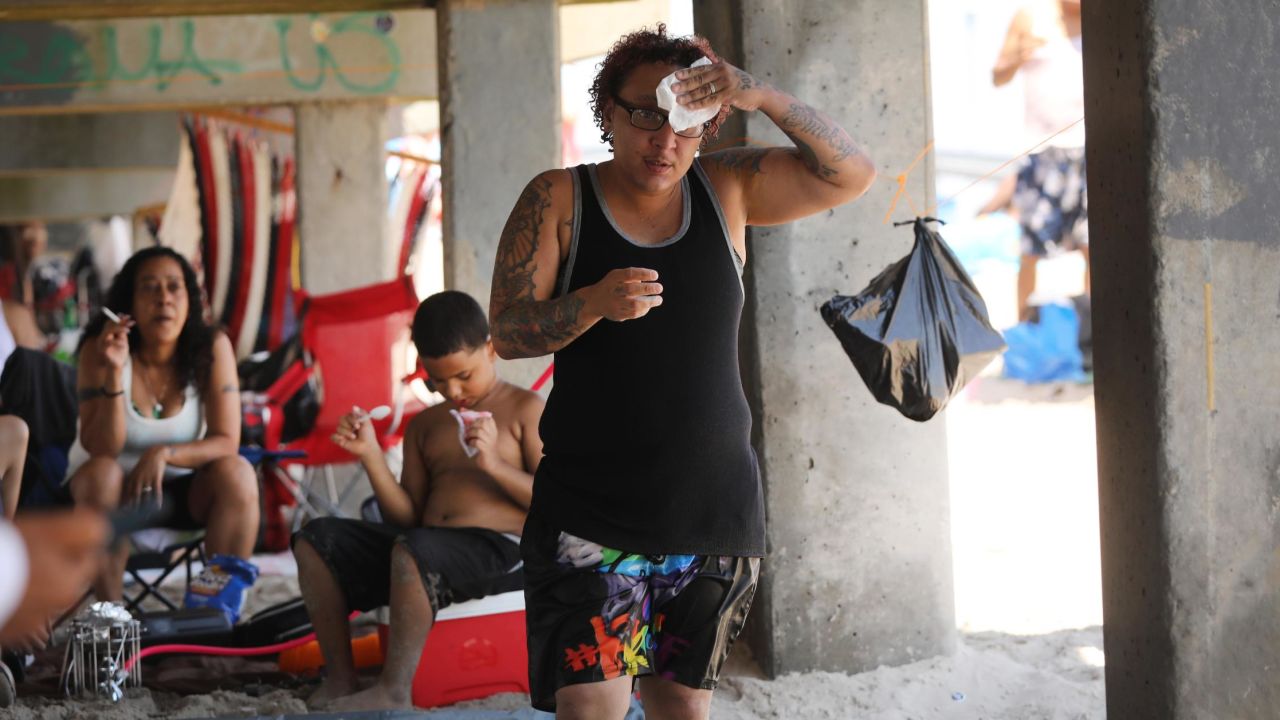 Hot weather, like here in Coney Island, New York, last month, impacts health.