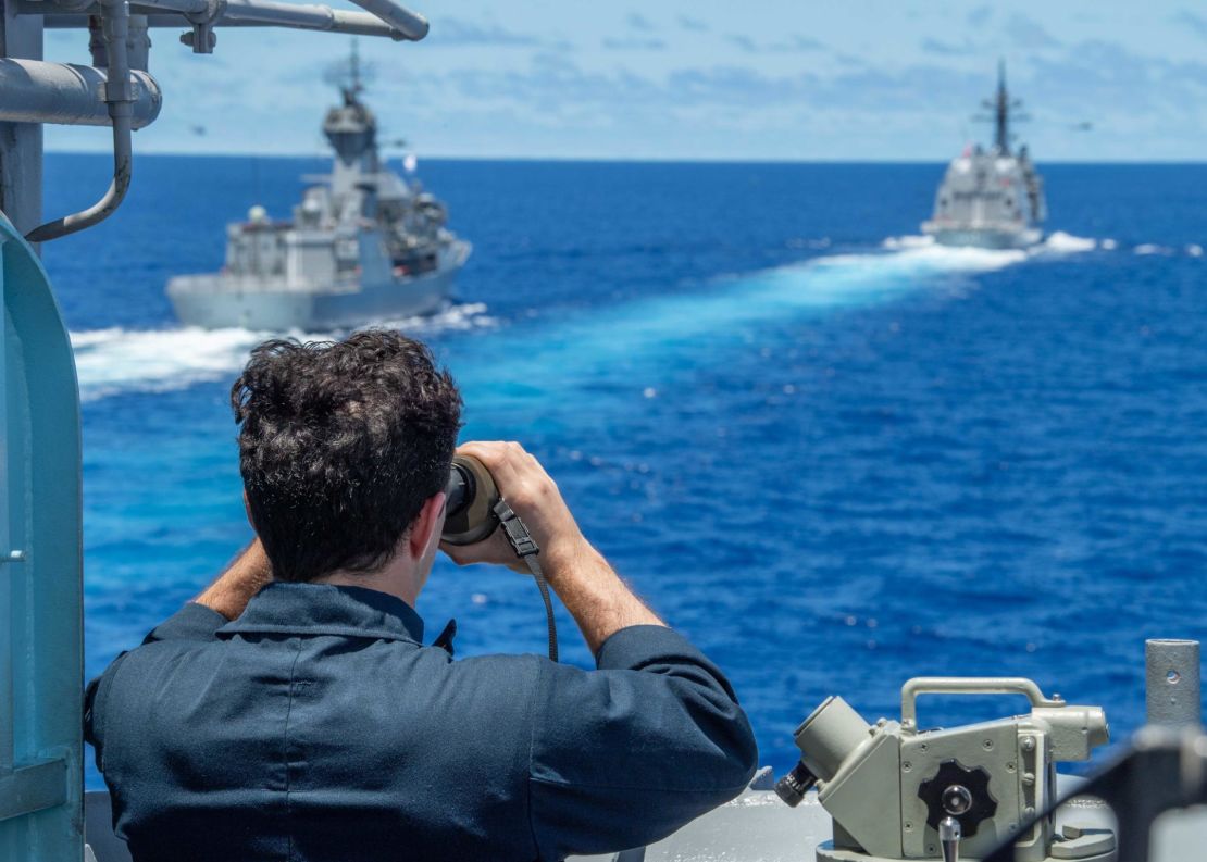 The Royal Australian Navy frigate HMAS Stuart, left, and the Japan Maritime Self-Defense Force destroyer JS Teruzuki are seen from the port bridge wing aboard the  guided-missile cruiser USS Antietam during a South China Sea exercise in July.