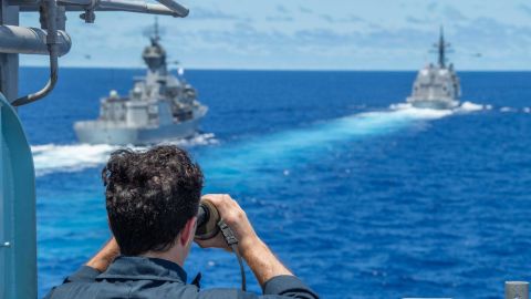 The Royal Australian Navy frigate HMAS Stuart, left, and the Japan Maritime Self-Defense Force destroyer JS Teruzuki are seen from the port bridge wing aboard the guided-missile cruiser USS Antietam during a South China Sea exercise in July.