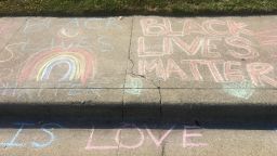 02 white man erases black lives matter chalk trnd