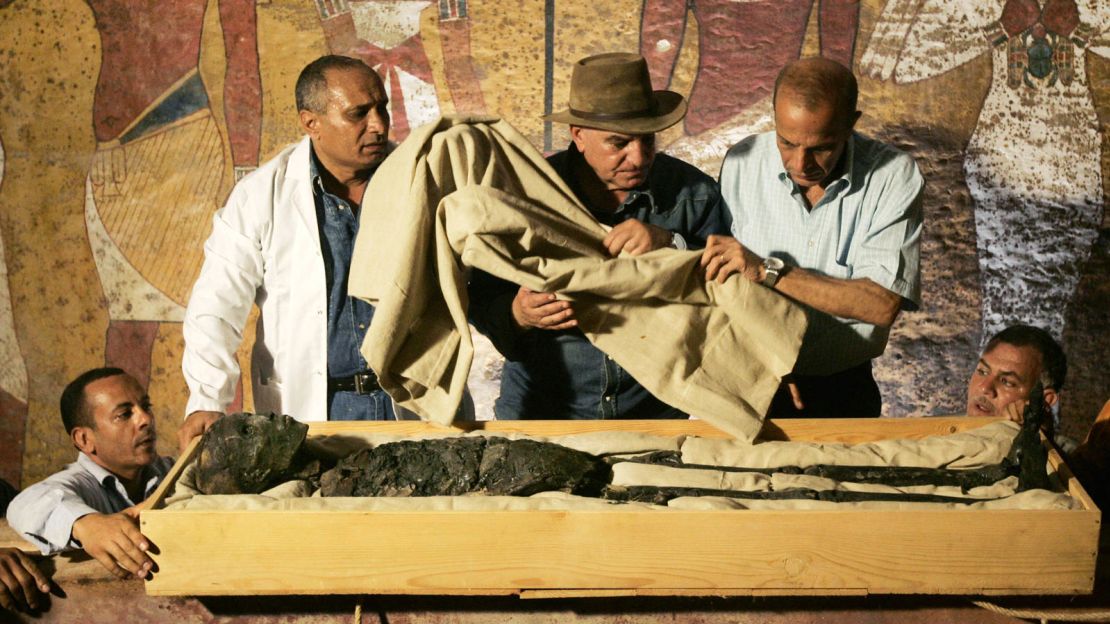 Egypt's former antiquities chief Zahi Hawass, wearing a hat, supervises the removal of King Tutankhamun from his tomb in 2007.