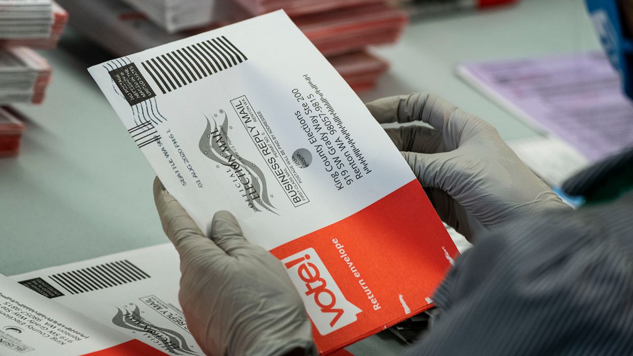 RENTON, WA - AUGUST 04: An elections worker opens ballots at the King County Elections headquarters on August 4, 2020 in Renton, Washington. Today is election day for the primary in Washington state, where voting is done almost exclusively by mail. (Photo by David Ryder/Getty Images)