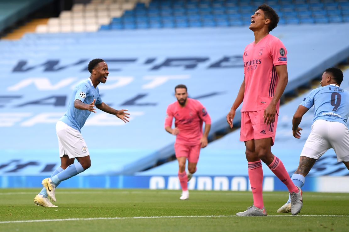 Raheem Sterling celebrates after scoring Manchester City's first goal.