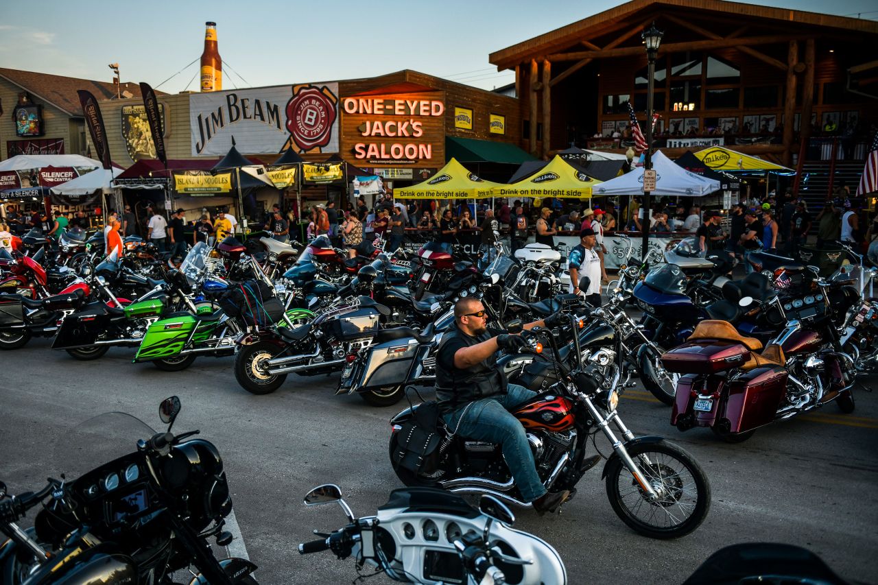 Motorcyclists drive down Main Street in Sturgis, South Dakota, during the annual <a href="https://www.cnn.com/2020/08/11/entertainment/smash-mouth-concert-sturgis-motorcycle-rally-trnd/index.html" target="_blank">Sturgis Motorcycle Rally</a> on Friday, August 7.