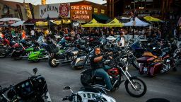 STURGIS, SD - AUGUST 07: Motorcyclists drive down Main Street during the 80th Annual Sturgis Motorcycle Rally on August 7, 2020 in Sturgis, South Dakota. While the rally usually attracts around 500,000 people, officials estimate that more than 250,000 people may still show up to this year's festival despite the coronavirus pandemic. (Photo by Michael Ciaglo/Getty Images)