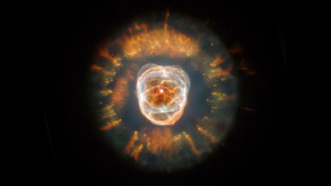 Seen in this NASA photo, nebula NGC 2392 is no longer called the "Eskimo Nebula," an offensive term. It is about 5,000 light years away. 
 