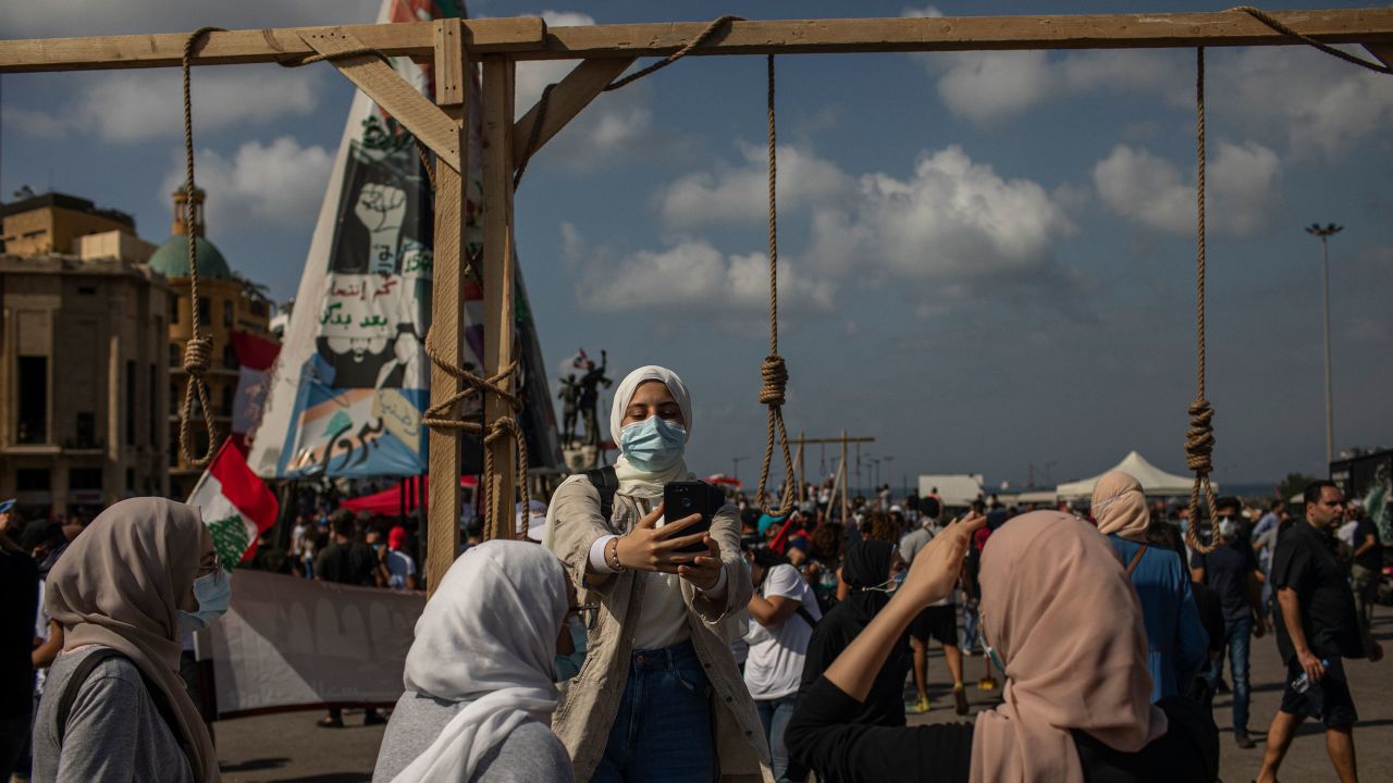 Dana Itani takes a selfie in Martyr Square. "These politicians deserve to be hanged here," Itani said.