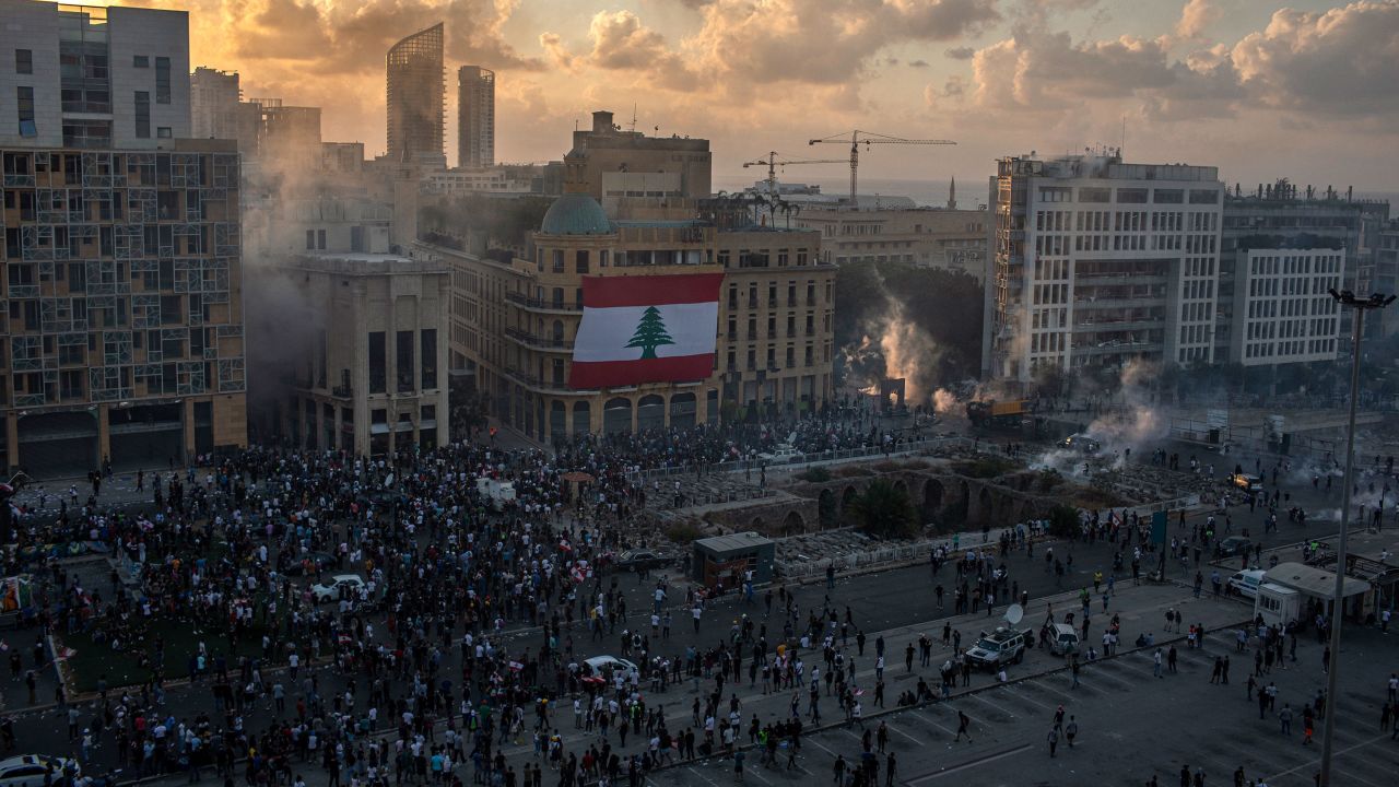 A general view shows thousands of protesters facing riot police in Beirut.