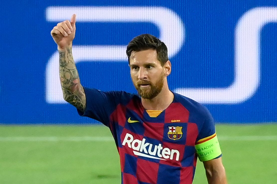 Lionel Messi celebrates after scoring Barcelona's brilliant second goal against Napoli in the Champions League last 16 second round tie in the Camp Nou.