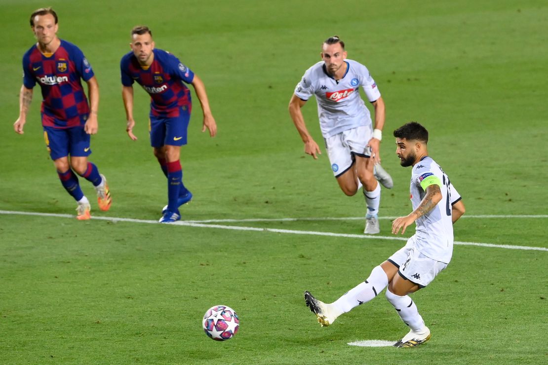 Napoli's Lorenzo Insigne scores from the spot to pull a goal back for his side against Barcelona in the Camp Nou.