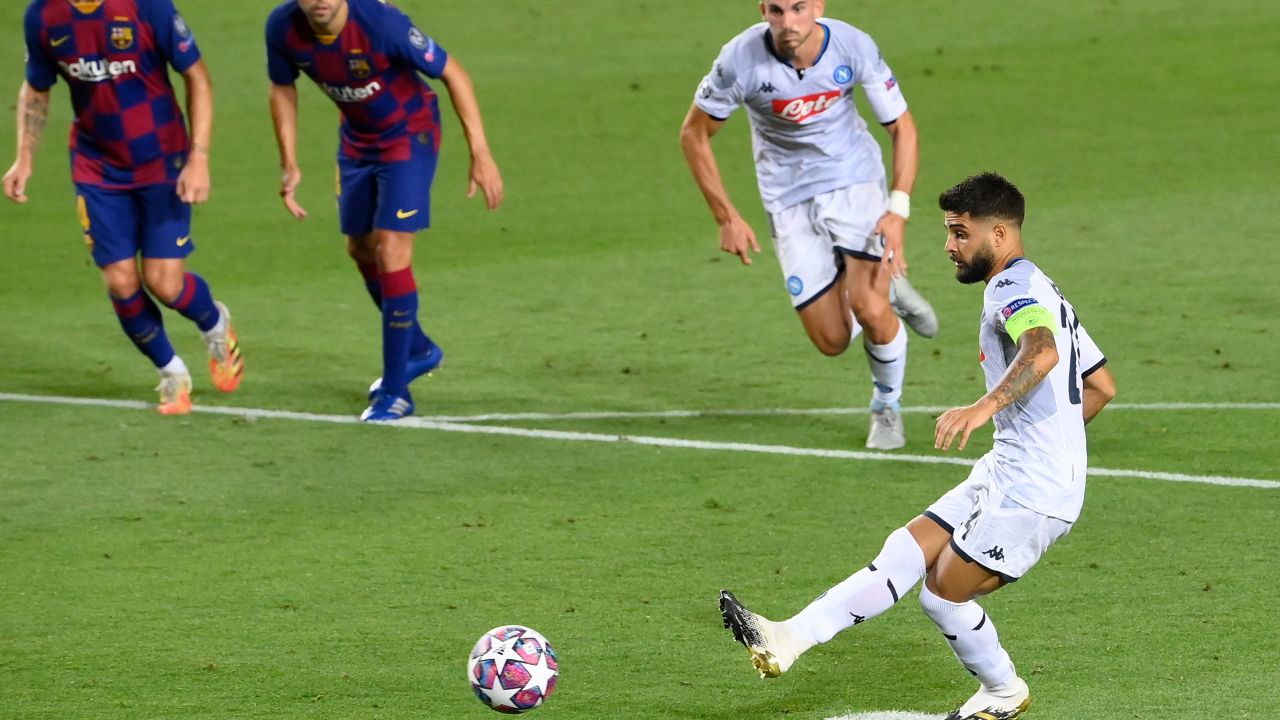 Napoli's Lorenzo Insigne scores from the spot to pull a goal back for his side against Barcelona in the Camp Nou.