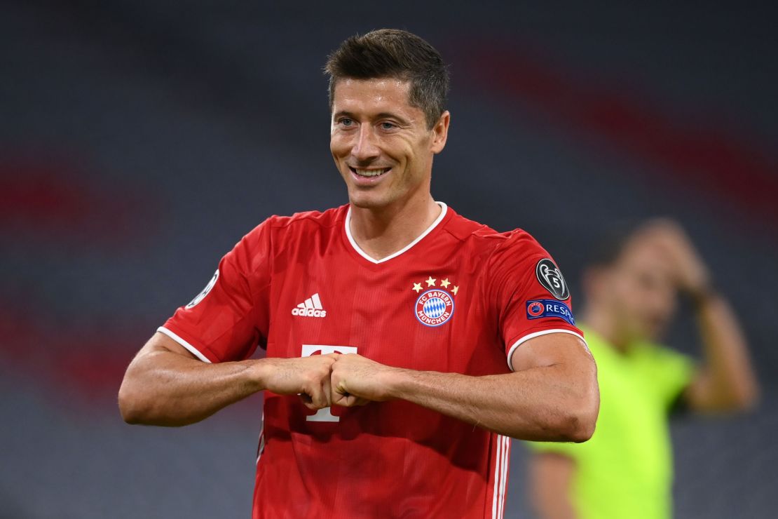 Robert Lewandowski celebrates after scoring his 52nd goal of the season to put his side Bayern Munich ahead from the penalty spot during the Champions League round of 16 second leg match against Chelsea.