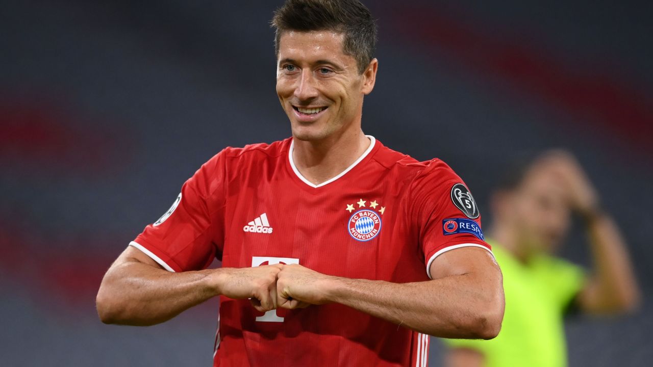 Robert Lewandowski celebrates after scoring his 52nd goal of the season to put his side Bayern Munich ahead from the penalty spot during the Champions League round of 16 second leg match against Chelsea.