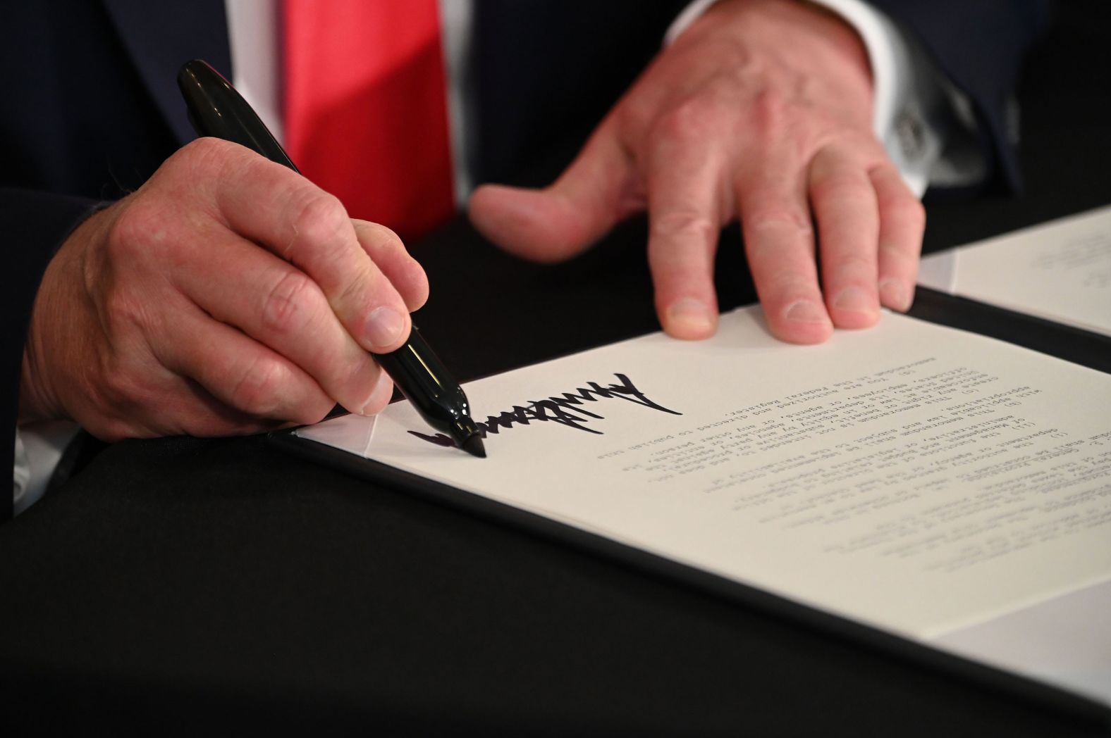 Trump signs executive orders <a href="index.php?page=&url=https%3A%2F%2Fwww.cnn.com%2F2020%2F08%2F08%2Fpolitics%2Ftrump-executive-order-stimulus%2Findex.html" target="_blank">extending coronavirus economic relief</a> in August 2020. It came after Democrats and the White House were unable to reach an agreement on a stimulus bill.