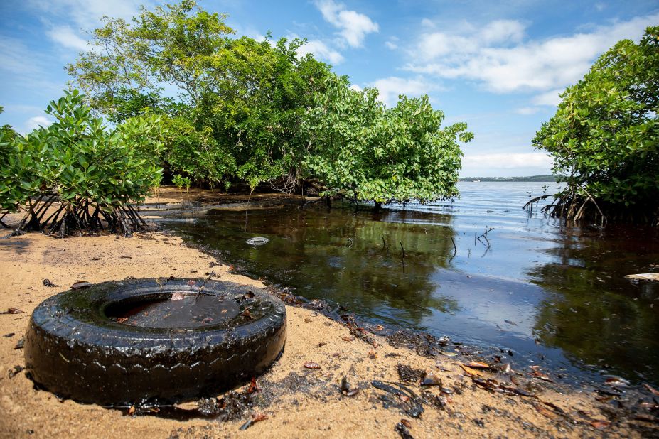 Washed-up oil is seen on a beach on August 9.