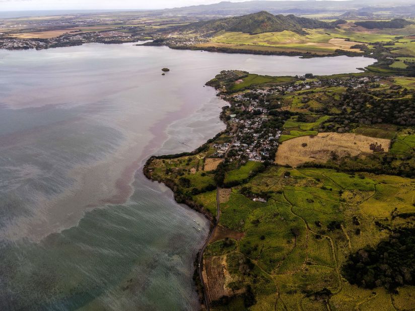 Leaked oil is pushed by currents in the bay of Grand Port.