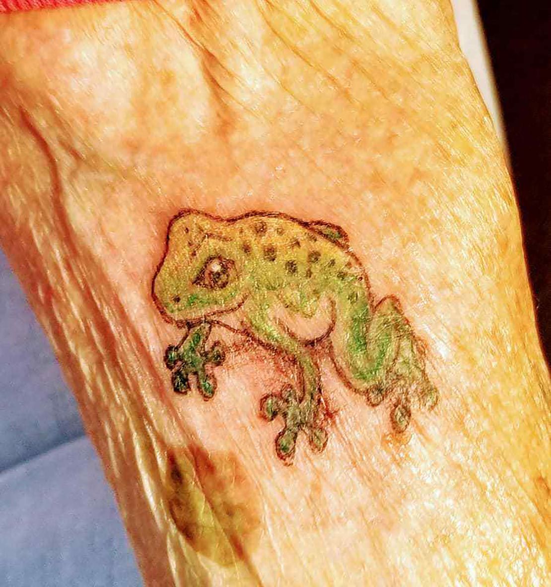 Pollack's new frog tattoo.