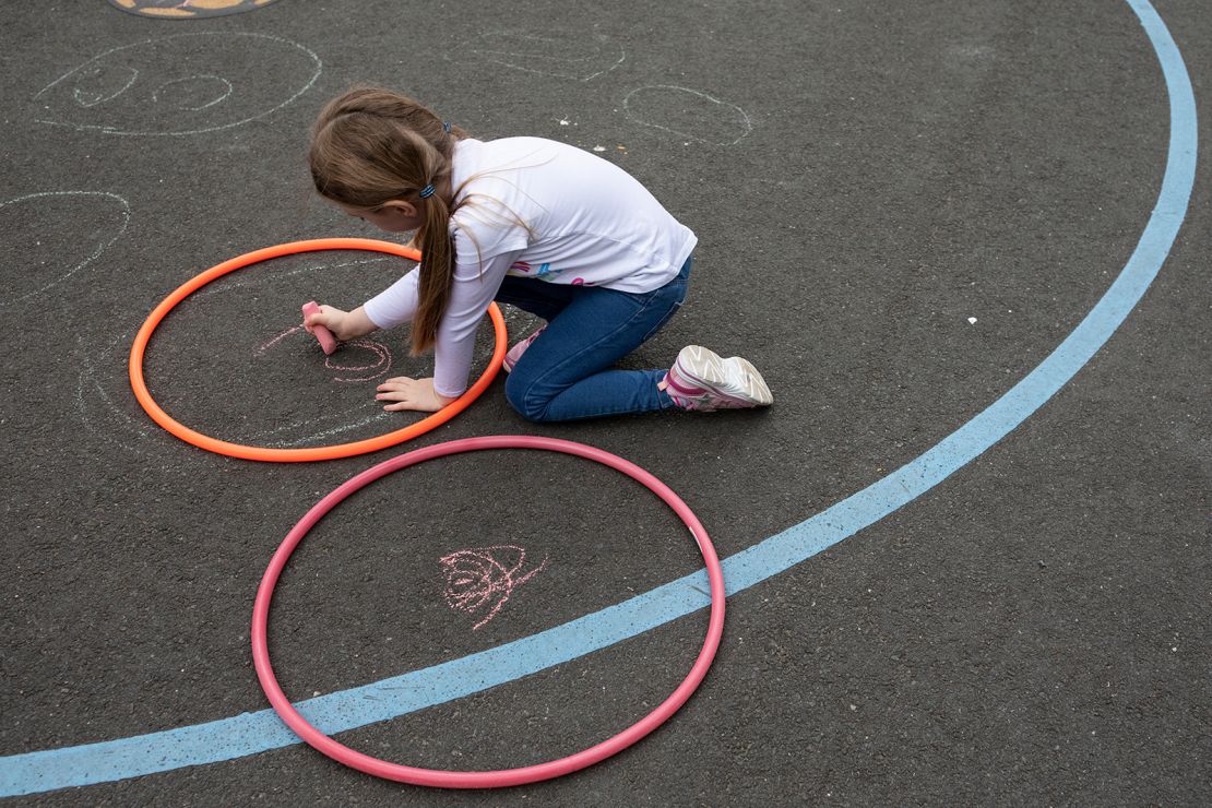 Children maintain social distancing measures at a school in London in June. 